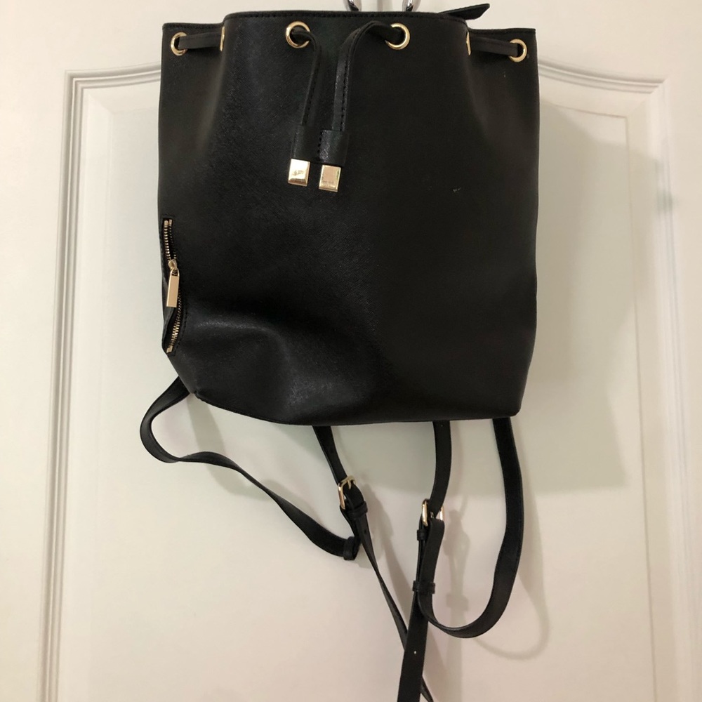 Textured Leather Purse Backpack from Barney’s